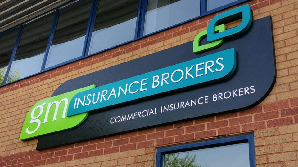 A professional business sign displayed on a business building.