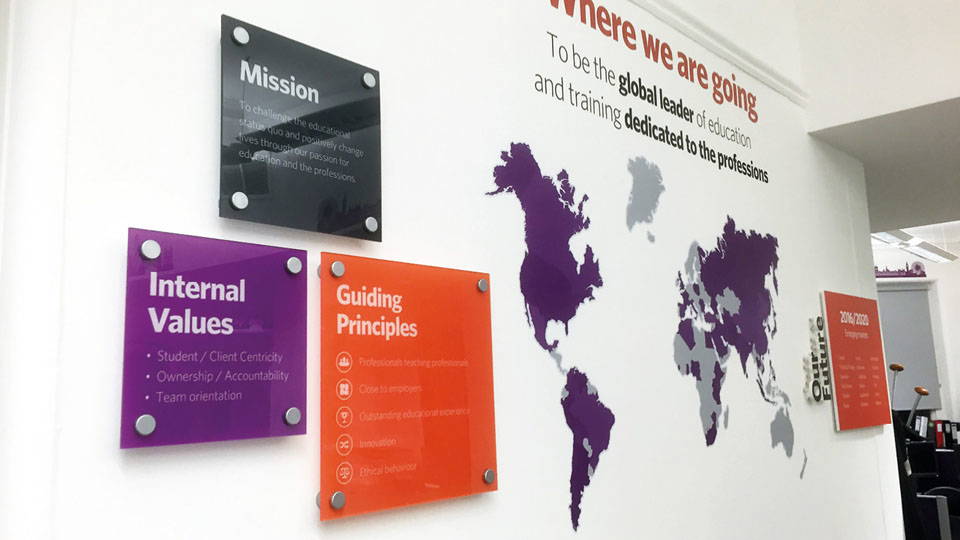 An image of multiple acrylic signs with standoffs.