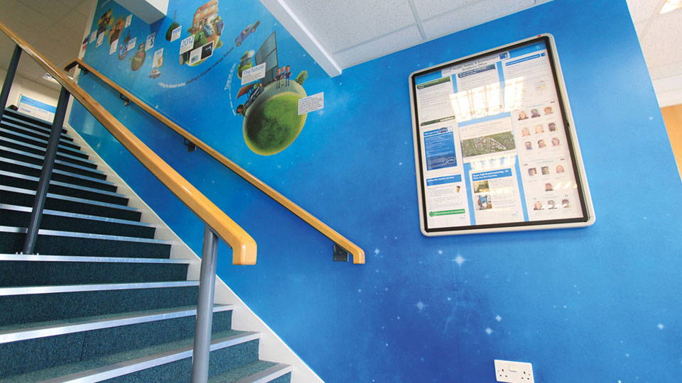 A wall with graphics displayed on its surface